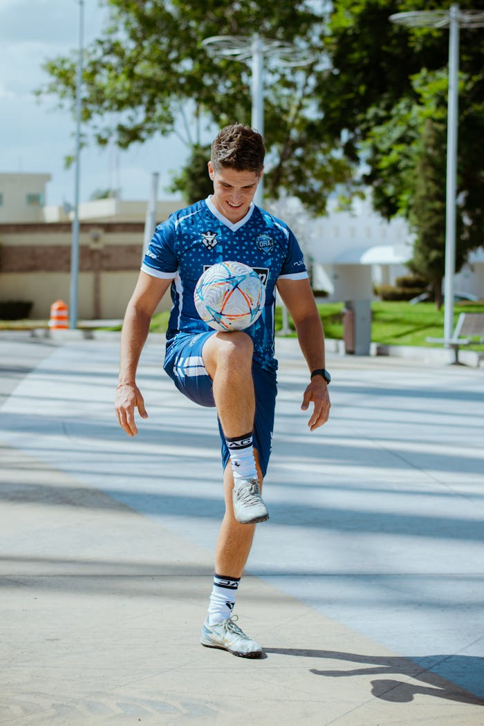 stats-img young-man-juggling-soccer-ball-in-urban-park-33264711