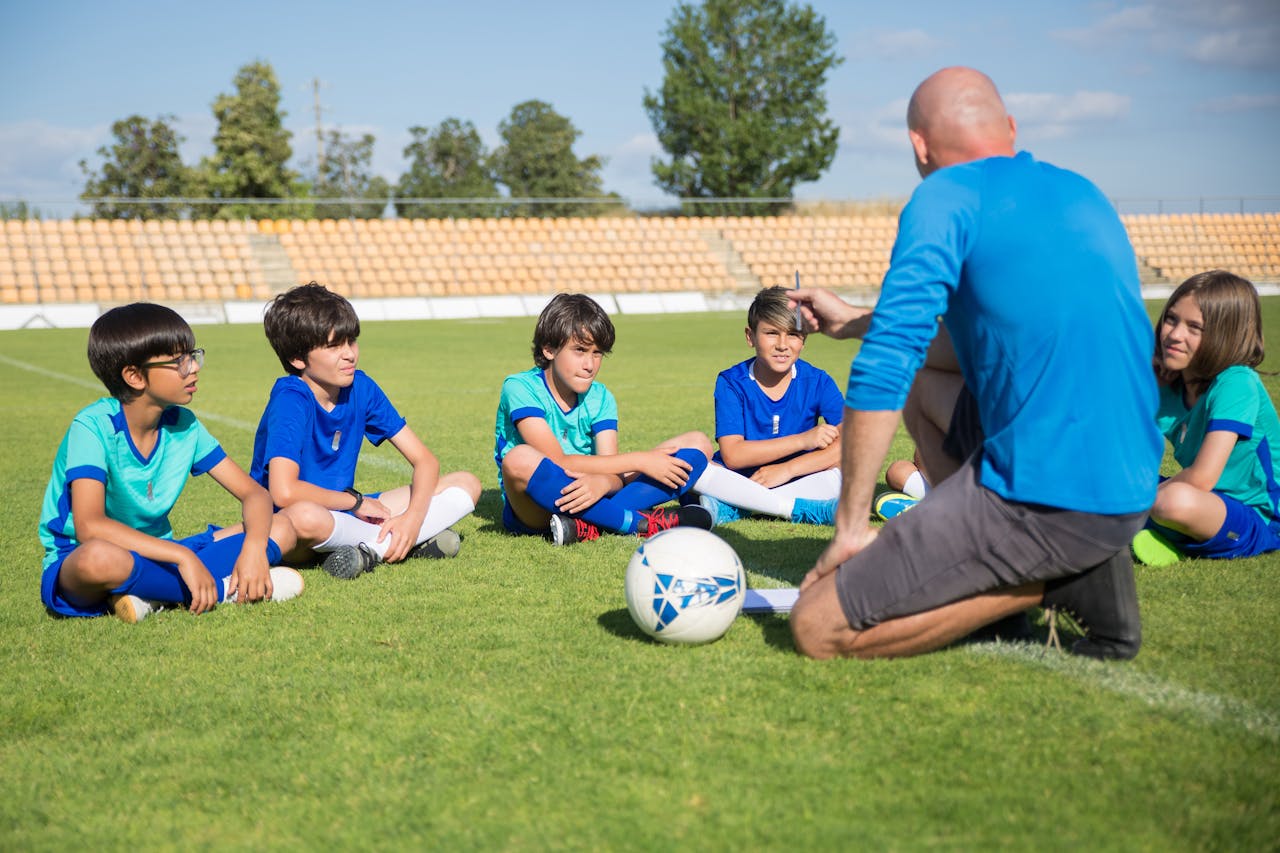 portfolio-04 Children gather for a soccer coaching session on a sunny day in Portugal.